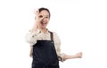 Joyful young asian woman wearing apron is barista attire gesturing OK with her hand, expressing satisfied. Royalty Free Stock Photo