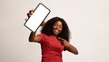 Joyful Young Black Woman Pointing On Big Blank Smartphone In Her Hand Royalty Free Stock Photo