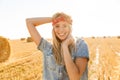 Joyful young blonde girl in headband