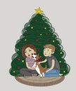 joyful young couple laughing, with a corgi dog with a red bow around his neck, sitting together near the christmas tree at home on