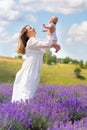 Joyful young mother playing with her baby son Royalty Free Stock Photo