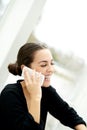 Joyful young woman chatting on her mobile Royalty Free Stock Photo