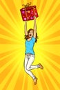 Joyful young woman jumping up with a gift