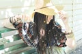 Joyful young woman portrait with dreadlocks dressed in boho style dress and hat Royalty Free Stock Photo