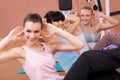 Joyful young women working out