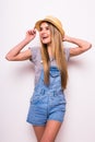 Joyfull girl in cup and summer clothes on white