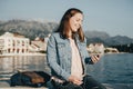 Joyfull Young woman listening to music on headphones with phone