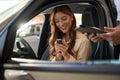 Smiling automotive buyer looking at car remote control in hands Royalty Free Stock Photo