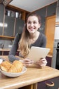 joyous beautiful young woman looking away from her morning messages