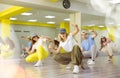 Joyous boy and girls dancing hip hop at lesson in class Royalty Free Stock Photo