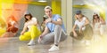 Joyous boy and girls dancing hip hop at lesson in class Royalty Free Stock Photo