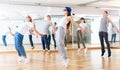 Joyous boy and girls dancing hip hop at lesson in the class Royalty Free Stock Photo