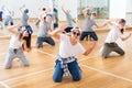 Joyous boy and girls dancing hip hop at lesson in the class Royalty Free Stock Photo