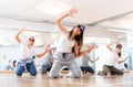 Joyous boy and girls dancing hip hop at lesson in the class Royalty Free Stock Photo