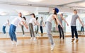 Joyous boy and girls dancing hip hop at lesson in the class Royalty Free Stock Photo