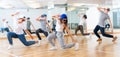 Joyous boy and girls dancing hip hop at lesson in the class Royalty Free Stock Photo