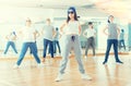 Joyous boy and girls dancing hip hop at lesson in the class Royalty Free Stock Photo