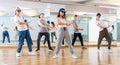 Joyous boy and girls dancing hip hop at lesson in the class Royalty Free Stock Photo