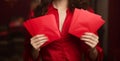 Joyous celebration Woman holding red envelope for Lunar New Year