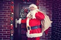 Joyous coming Santa Claus in home for Christmas Royalty Free Stock Photo
