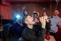 Joyous emotional man in karaoke, singing Royalty Free Stock Photo
