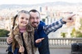 joyous father and daughter pointing at sight during sightseeing tour