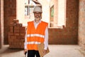 Joyous foreman posing for camera during building site inspection Royalty Free Stock Photo