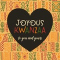 Joyous Kwanzaa Greeting card in heart frame on African ethnic tribal clash ornament seamless pattern background. Cute