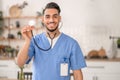 Joyous physician showing a medical instrument before the camera Royalty Free Stock Photo