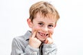 Joyous child  laughing, giggling, playing with a fake toothless smile Royalty Free Stock Photo