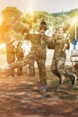 joyous young man and woman in full paintball gear having fun aft Royalty Free Stock Photo