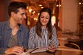 Joyously happy young couple in restaurant Royalty Free Stock Photo