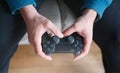 Joystick for game console in the mans hands.The concept of leisure and entertainment Royalty Free Stock Photo