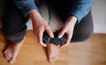 Joystick for game console in the mans hands.The concept of leisure and entertainment Royalty Free Stock Photo