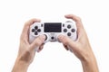 Joystick gaming controller in hand isolated on white background , Video game console developed Interactive Entertainment