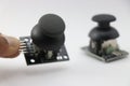 Joystick module with dual axis control used in making electronics projects held in hand