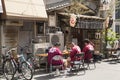 three men resting during the sanja matsuri festival in tokyo japan