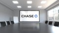 JPMorgan Chase Bank logo on the screen in a meeting room. Editorial 3D rendering