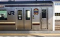 JR train stopping at station in Hiroshima, Japan Royalty Free Stock Photo