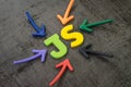 JS, Javascript modern programming language for software development or application concept, multi color arrows pointing to the Royalty Free Stock Photo