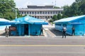 JSA within DMZ, Korea - September 8 2017: UN soldiers and soldiers on a sunny day in front of blue buildings at North South Korean Royalty Free Stock Photo