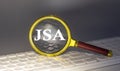 JSA - Joint Sales Agreement text on magnifier on a keyboard, business concept