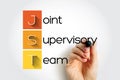 JST - Joint Supervisory Team acronym with marker, concept background