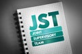 JST - Joint Supervisory Team acronym on notepad, business concept background Royalty Free Stock Photo