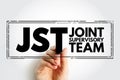 JST - Joint Supervisory Team acronym text stamp, business concept background Royalty Free Stock Photo