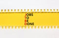 JTBD jobs to be done symbol. Concept words JTBD jobs to be done on yellow paper on beautiful white and yellow background. Business