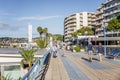 Juan Le Pen, France, 10/06/2019: Tourists walk on the promenade of the resort town on the Cote d`Azur on a bright sunny day