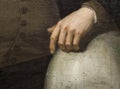 Juan Sebastian Elcano portrait. Hand over earth globe detail