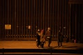 Juarez, Mexico 07-21-2023: migrants wait to be processed by the border patrol in front of the wall in American territory, to reque