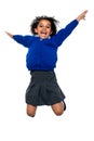 Jubilant school kid jumping high up in the air Royalty Free Stock Photo